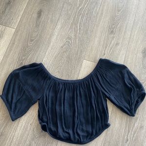 Black off the shoulder cropped mid sleeve top.